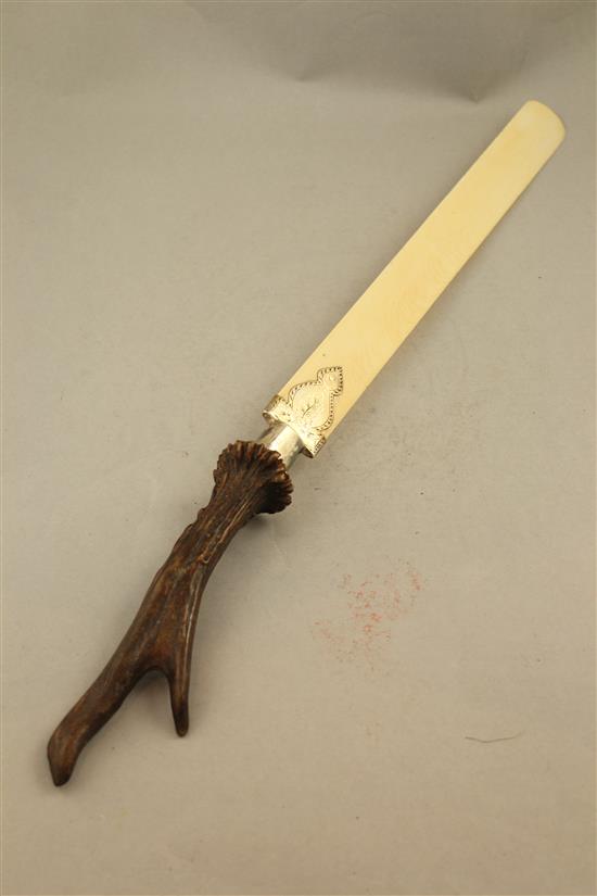 A Victorian ivory and horn handled silver mounted page turner, 21in.